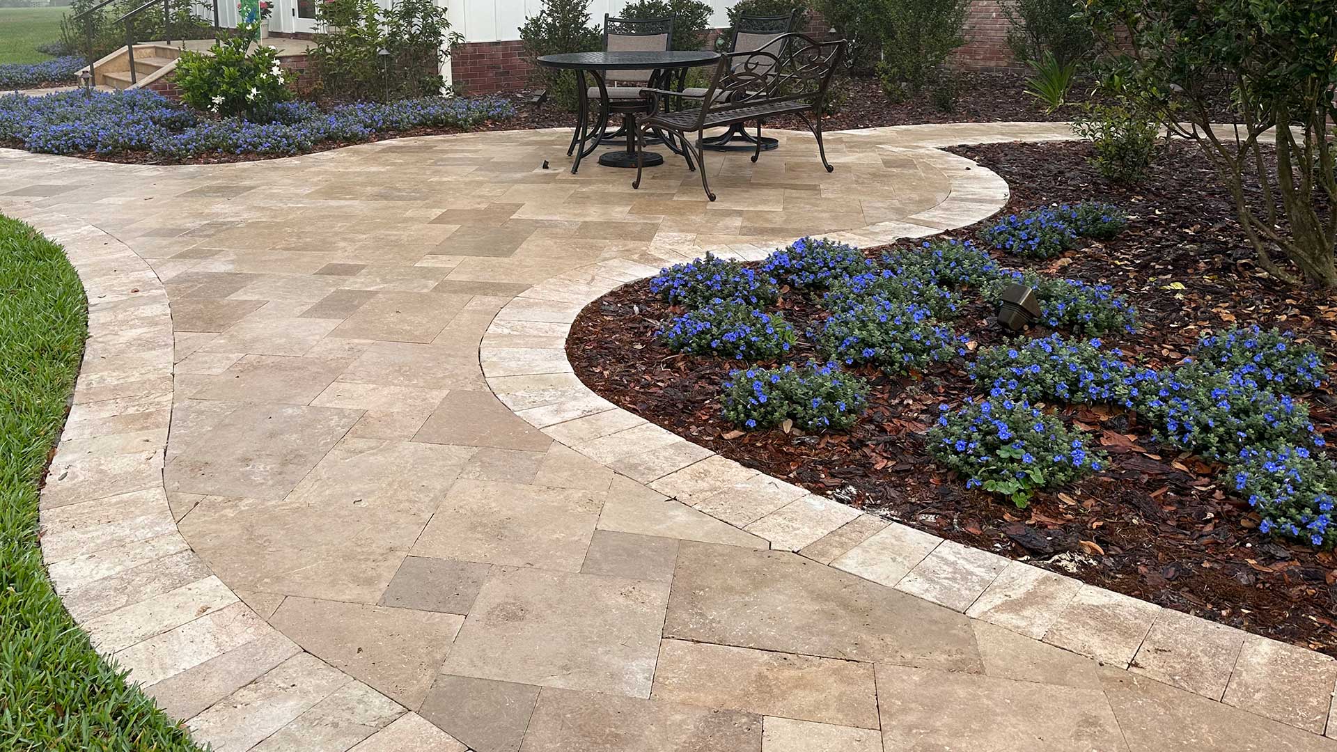 New travertine paver walkway and patio installed at a home in Highland City, FL. 